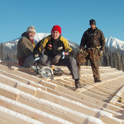 Construction crew from Kwadacha building snow rooves over camp bunkhouse in 2007